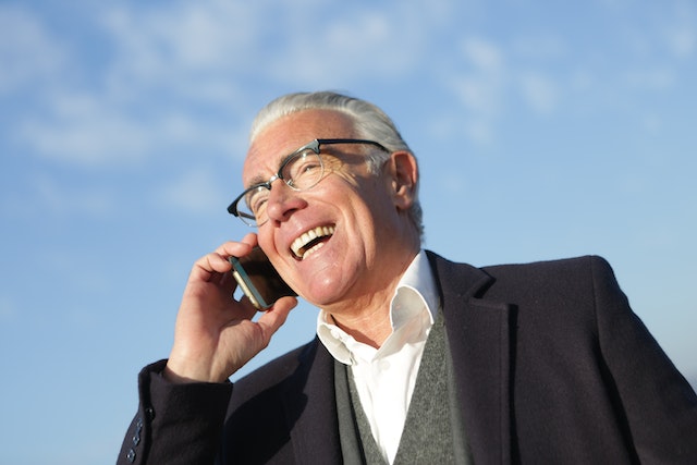 Senior Businessman Smiling While Talking on Mobile Phone Market to Thrive! Thrive with marive