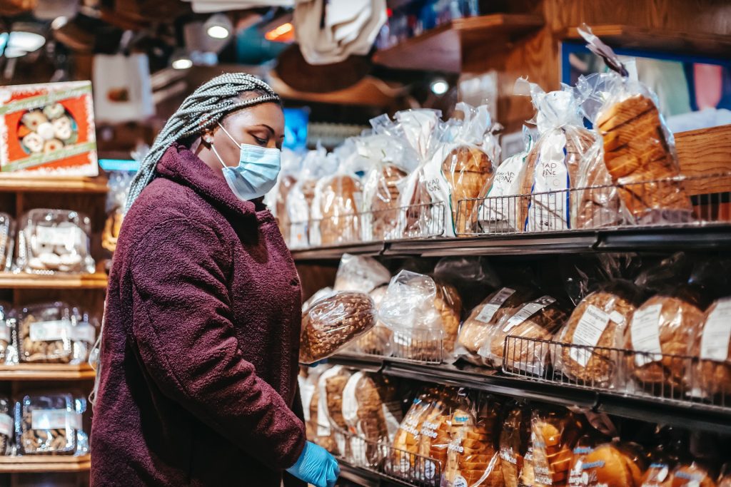 Woman Shopping for Bread in a Grocery Store Market to Thrive! Thrive with marive